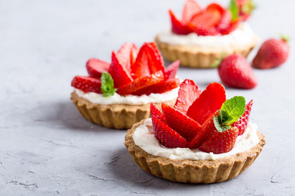 Orange County Restaurant Week preview dessert featuring fresh strawberry and cream tarts.