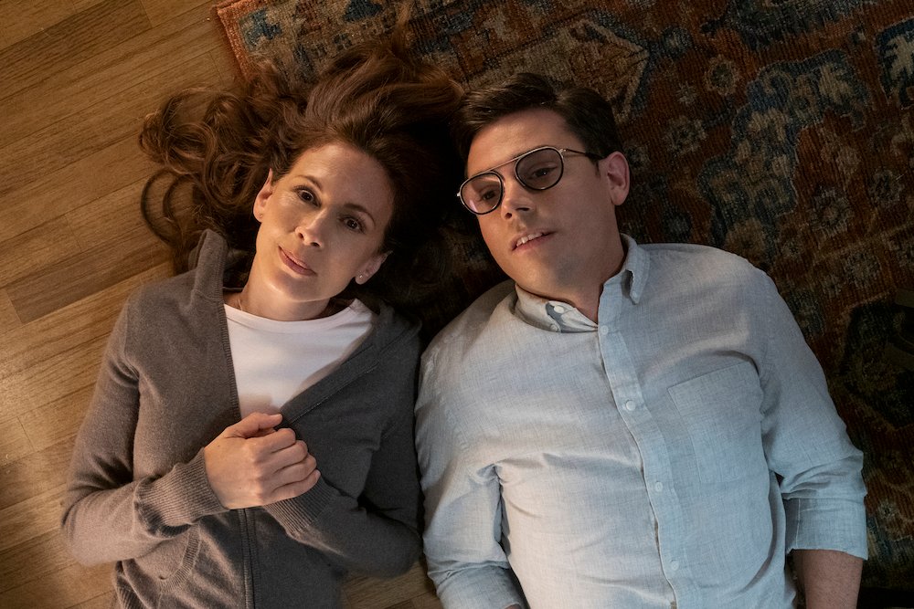 Image from a scene in SPECIAL season 2 showing Ryan O'Connell and Jessica Hecht gently lying next to each other on the floor chatting.