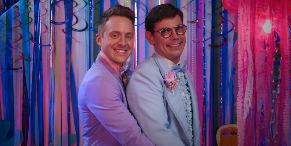 From season 2 of SPECIAL: Two gay men in pastel tuxedos posing for a cheesy prom photo.