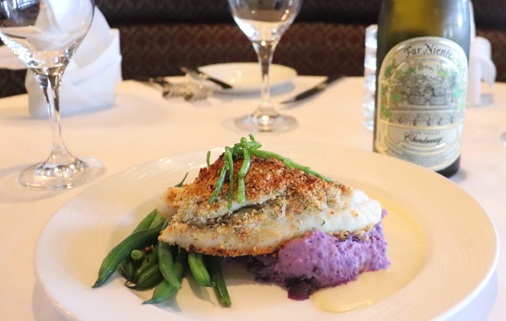 John Dory Fish coated in macadamia nut and panko bread crumb with lemon butter sauce atop, accompanied with a side of Purple Peruvian Mashed Potatoes.