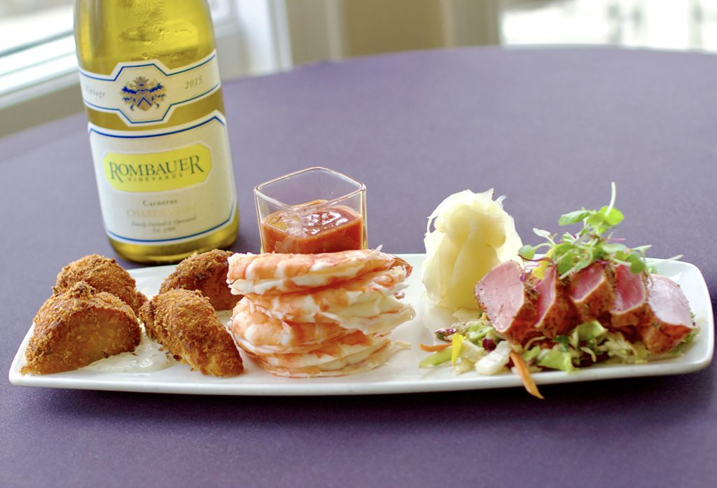 Seaside Sampler with Chesapeake Bay Style Crab Cakes, chilled Mexican Prawns and Ahi Sashimi.